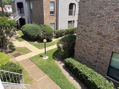 Well-maintained complex courtyard with brick and s