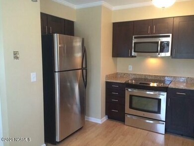 Kitchen with refrigerator in view