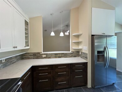 Kitchen with stainless steel fridge, decorative b