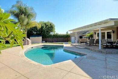 Remodeled pool with pebble finish and new decking.