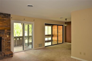Living room opens to dining room and two sliders o