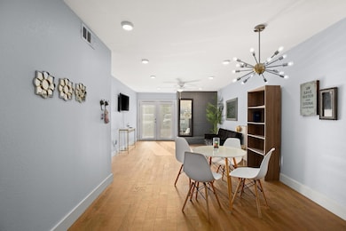 Dining area with visible vents, baseboards, light