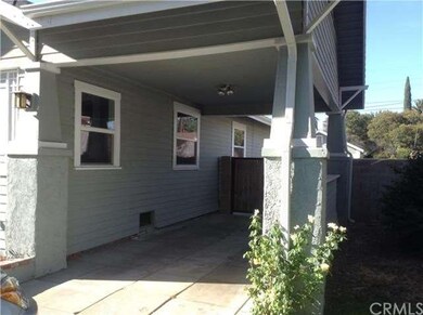 Carport with fenced yard leading to 2 car detached