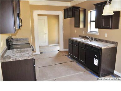 Any cook will love this kitchen with dark cabinets