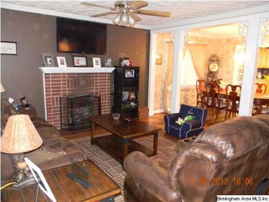 Living room opens to the dining area/kitchen.