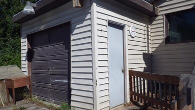 Single Garage and Man Door