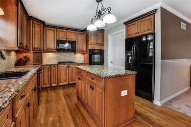 Bring your groceries right into the kitchen from your attached garage!  Kitchen opens to dining room and family room.