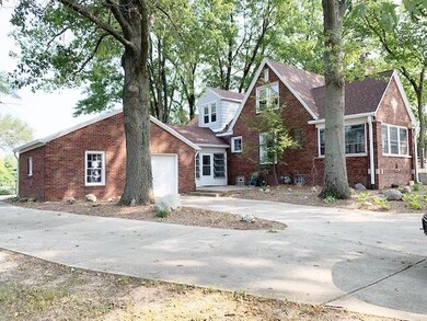 2 Car attached garage, one overhead door on front, one overhead door on rear. Glass enclosed breezeway connects garage to home.