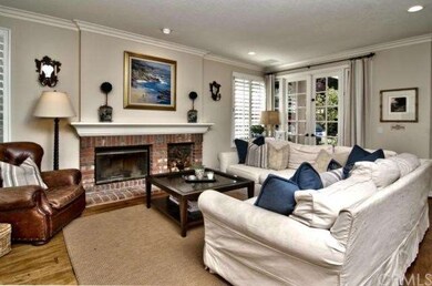 Family Room with wood burning fireplace and French