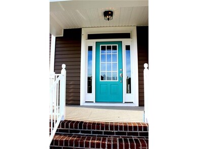 Covered front entry with room for rocking chairs.