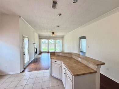 Open flow from kitchen, breakfast nook, and bar top to the living and family room for easy entertaining.