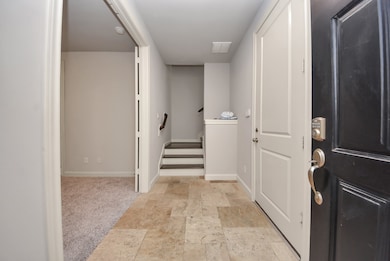 As soon as you enter you will find the garage on your right and the en-suite downstairs bedroom is on your left.