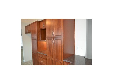 Custom cabinets, rollout shelving in the pantry, q