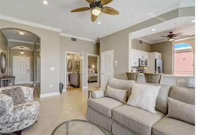Living room featuring crown molding, sink, light t