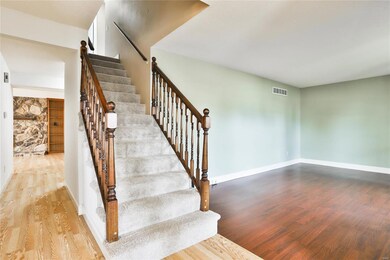 Entry foyer opens to the living room to the right,