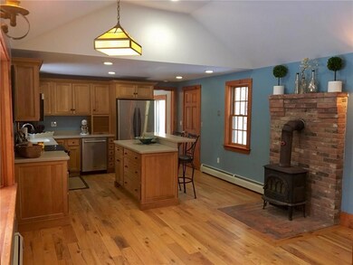 Kitchen features Maple floors and...