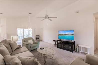 Living room featuring light colored carpet, ceilin