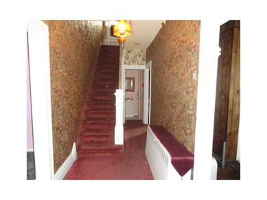 Entry/Foyer. Spacious hallway features original wo