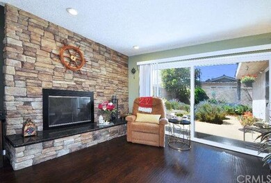 Living Room with Fireplace and View to Patio