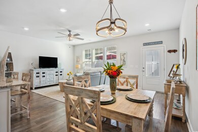 Dining space with dark wood-type flooring and ceil