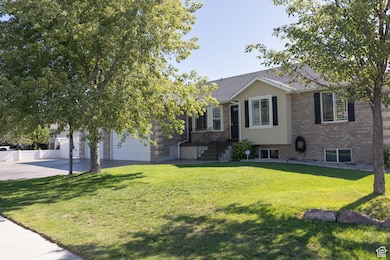 View of front of home with brick siding and concrete driveway