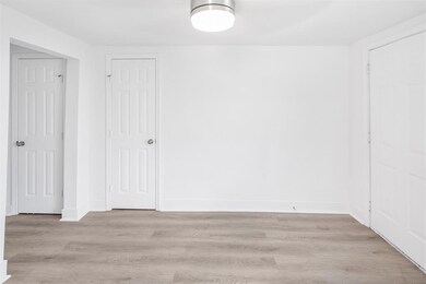 This room features a clean, modern design with whi