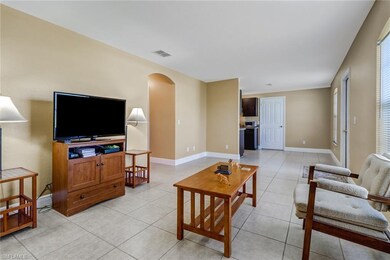 Living room with hallway leading to bedrooms and d
