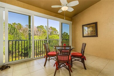 Sunroom with ceiling fan and vaulted ceiling