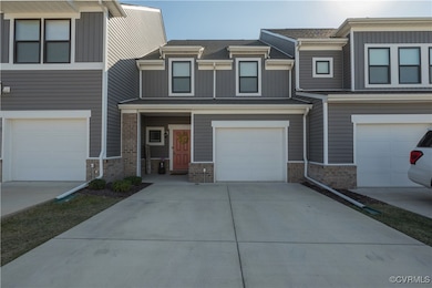 Townhome / multi-family property with a garage