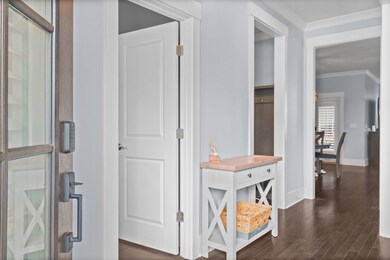 As you walk through the front door there is a hallway that separates the en suite bedroom, mudroom, formal dining room and takes you into the open floor plan kitchen, dining nook & living room.
