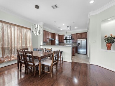 As you walk towards the kitchen, the staircase to
