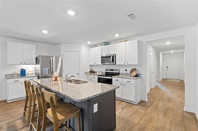 Kitchen featuring appliances with stainless steel 