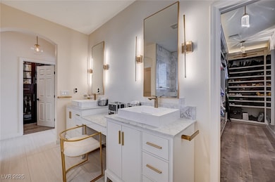 Primary Full bathroom with visible vents, a sink,