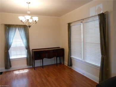 Dining room with newer wood laminate flooring.