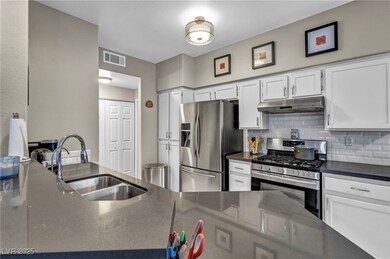 Kitchen with appliances with stainless steel finis