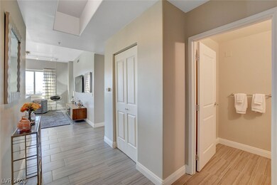 Grand entrance w/powder room on the right for arri