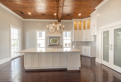 Countertops are Quartz. Large floor-to-ceiling win