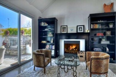 Living room with fireplace and built-in shelving h