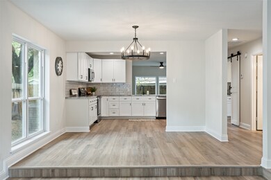 RE-DESIGNED kitchen open to the DINING area