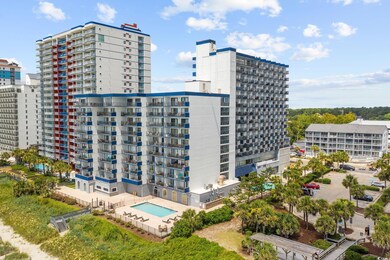 View of apartment building / complex with a city view
