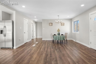 Dining area featuring dark hardwood / wood-style f