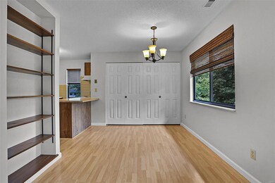 Dining / living room combo with built in shelving.