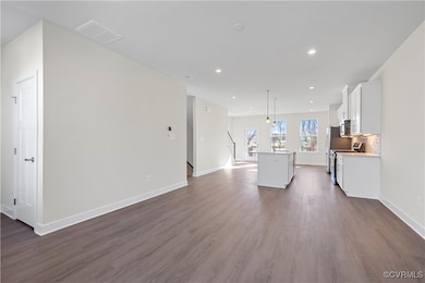 Living room featuring recessed lighting, baseboard
