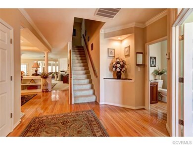 With hardwood, moldings and a lovely corner built-