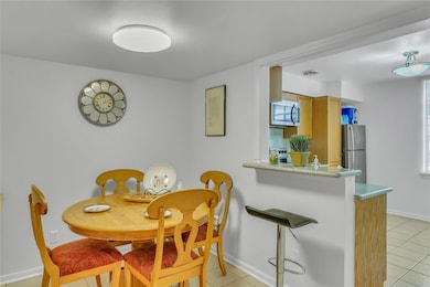 The dining room area opens up to the kitchen. Enjo