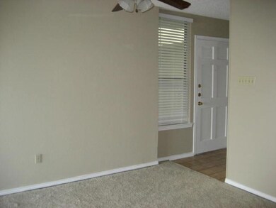 Empty room with carpet flooring and ceiling fan