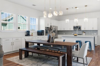 Not to be outdone by the kitchen lighting, but the pendant lighting over the dining room shines bright.