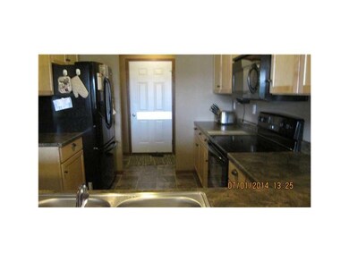 Kitchen. Enjoy the breakfast bar at the end of the
