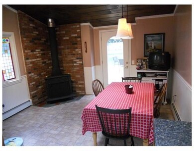 Dining Area. Breakfast room with wood stove
