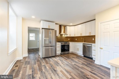 Kitchen with entrance to back room and bathroom